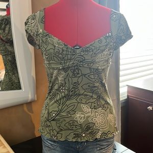 Green flower shirt low cut tie in back.